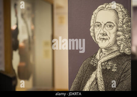 Hamburg, Germany. 13th June, 2017. A portrait of composer Georg Philipp Telemann (1681-1767), mounted on a pillar in the Telemann Museum in Hamburg, Germany, 13 June 2017. Violinists from Telemann's time are displayed in the background. The 250th anniversary of Telemann's death is on 25 June 2017. Photo: Christina Sabrowsky/dpa/Alamy Live News Stock Photo