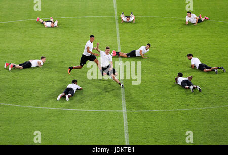 Cracow, Poland. 20th June, 2017. Player Davie Selke (L) attempts to catch his teammate Waldemar Anton while the rest of the squad lie on the pitch during training in Cracow, Poland, 20 June 2017. Germany will face off against Denmark for their second group stage match on 21 June. Photo: Jan Woitas/dpa-Zentralbild/dpa/Alamy Live News Stock Photo