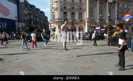 London, United Kingdom. 20th June, 2017. The Youth were out enjoying skipping in Piccadilly circus during the hot weather as a summertime heat wave hits London and the UK Credit: Michael Tubi/Alamy Live News Stock Photo