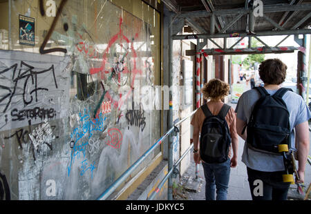 Hamburg, Germany. 21st June, 2017. A broken shop window is decorated with stickers and graffiti in the Schanze district of Hamburg, Germany, 21 June 2017. The G20 Summit will take place in Hamburg in July. Photo: Axel Heimken/dpa/Alamy Live News Stock Photo