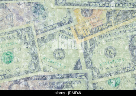 Banknotes under air bubble foil, british pounds or dollars Stock Photo