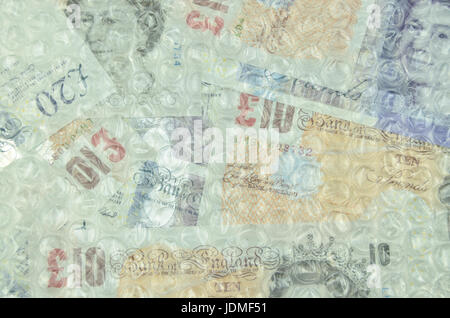 Banknotes under air bubble foil, british pounds or dollars Stock Photo