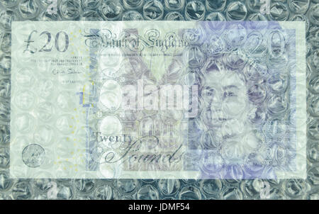 Banknotes under air bubble foil, british pounds or dollars Stock Photo
