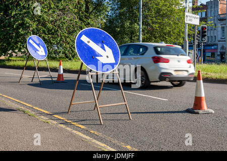 Temporary road lane closure with car passing traffic cones and Keep Right sign, Nottinghamshire, England, UK Stock Photo
