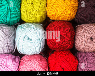 Various colors threads on rows in the store Stock Photo