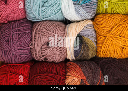 Various colors threads on rows in the store Stock Photo