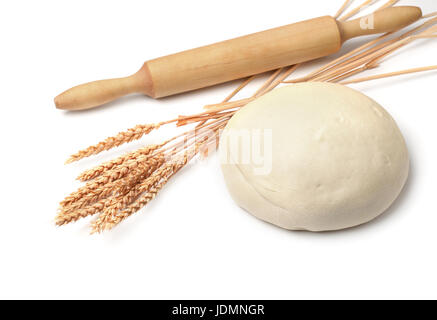 Fresh dough, wheat ears and rolling pin isolated on white Stock Photo
