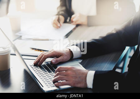 Businessman works with a laptop in office Stock Photo