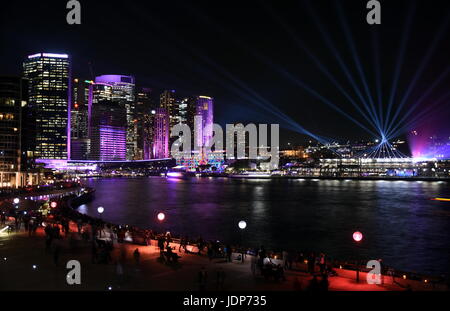 City lights and laser show in Circular Quay during the Sydney Vivid show, the free annual outdoor event of light music and ideas. View from Sydney Ope Stock Photo