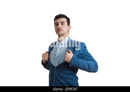 Young serious businessman acting with courage like a super hero and tearing his shirt off. Proud of yourself emotion isolated on white background. Stock Photo