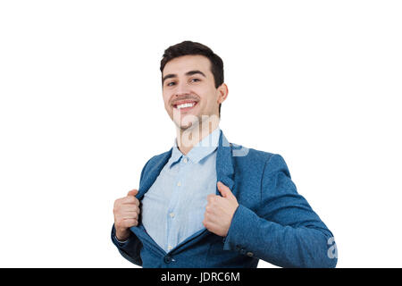 Young smiling businessman acting with courage like a super hero and tearing his shirt off. Proud of yourself emotion isolated on white background. Stock Photo