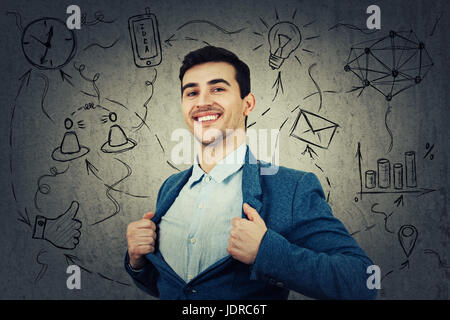 Young smiling businessman acting with courage like a super hero and tearing his shirt off. Proud of yourself emotion isolated on white background. Stock Photo