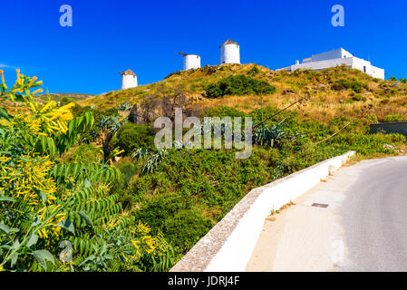 Traditional windmills in Tripodes also known as Vivlos, one of the largest and most picturesque villages in southwestern Naxos. Cyclades Islands. Stock Photo