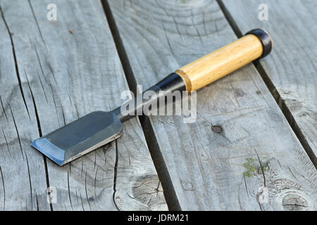 carpentry manual chisel on wooden table, handicraft traditional object Stock Photo