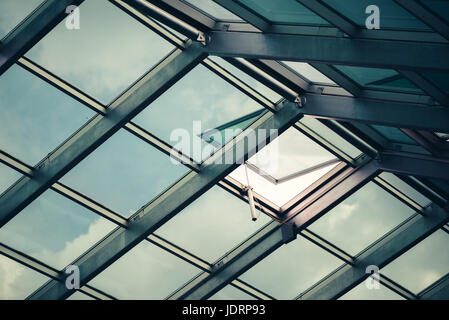 Glass skylight roof with open window, architectural feature detail Stock Photo