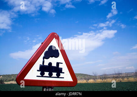 Crossing on the road, step to level without barriers via railway, Spain Stock Photo