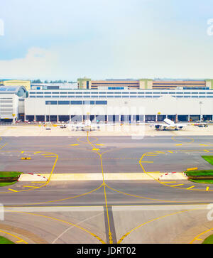 Airplanes at airport in the daytime. Aerial view. Singapore Stock Photo