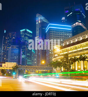 Traffic on a road in Downtown of Singapore. Motion blur