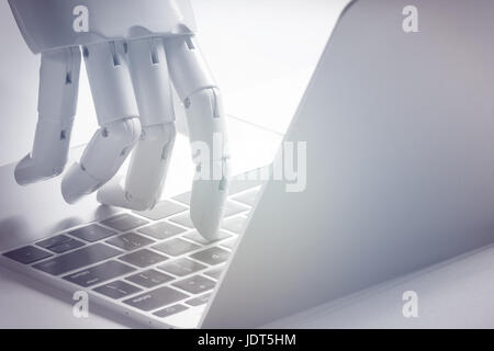 Artificial intelligence , robo advisor , chabot , robotic concept. Robot finger point to laptop button. Stock Photo