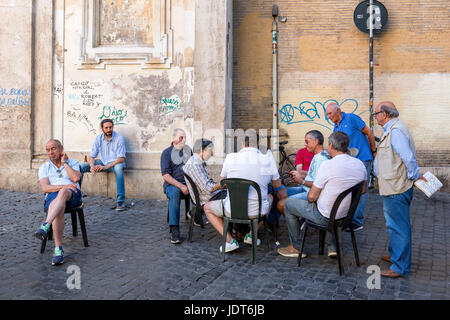 Italians playing card in the street, Trastevere, Rome, Italy Stock Photo