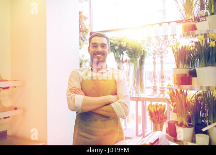florist man or seller at flower shop counter Stock Photo
