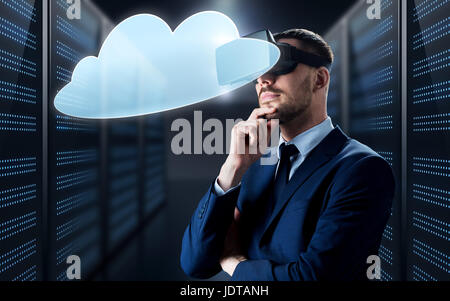 businessman in virtual reality headset with cloud Stock Photo