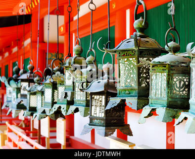 Rows of metal lanterns hanging in Kasuga Taisha Shrine, Nara, Japan Stock Photo