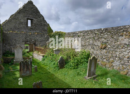 Old ruined church  and graveyard  of St. Cuthbert's at Dunluce in County Antrim Stock Photo