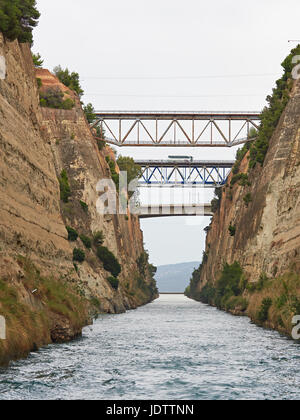 Corinth Canal connects the Gulf of Corinth with the Aegean and cuts through the land that separates the Peloponnese from the Greek mainland Stock Photo