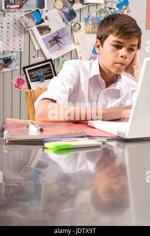 Boy doing homework at home Stock Photo