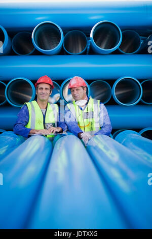 Workers talking in factory Stock Photo