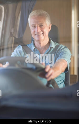 Smiling older man driving RV Stock Photo - Alamy