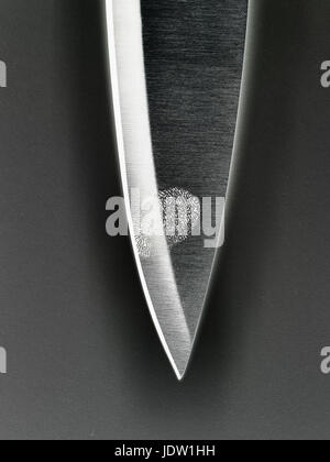 Close up of fingerprint on knife blade Stock Photo