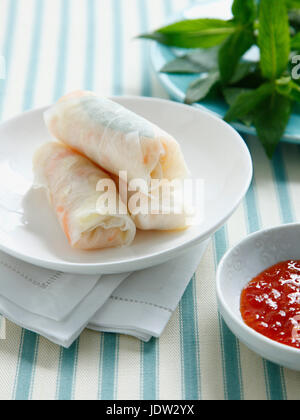 Plate of salad rolls and sauce Stock Photo