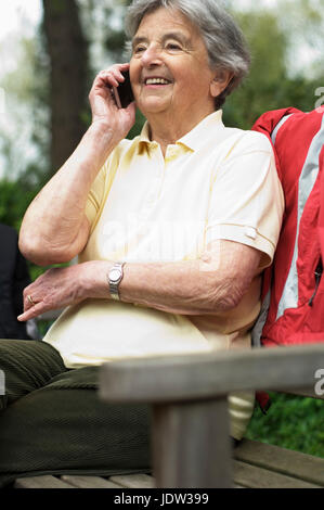 Older woman talking on cell phone Stock Photo