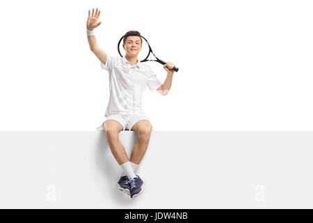 Teenage tennis player sitting on a panel and waving isolated on white background Stock Photo