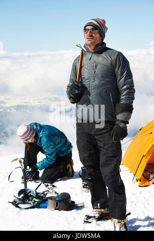 Mid adult couple by tent, Chamonix, France Stock Photo