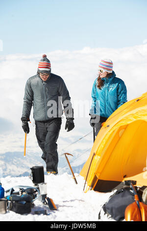 Mid adult couple by tent, Chamonix, France Stock Photo