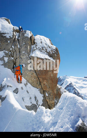 Two men mountain climbing, Chamonix, France Stock Photo
