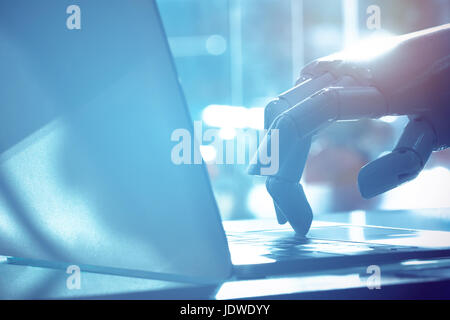 Robot finger point to laptop button with blue tone image. Chat bot , artificial intelligence , robo advisor , robotic concept. Stock Photo