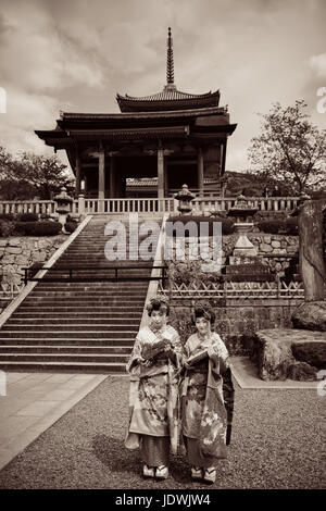 KYOTO, JAPAN - MAY 18: Geisha stand in Shrine on May 18, 2013 in Kyoto. Former imperial capital of Japan for more than one thousand years, it has the  Stock Photo