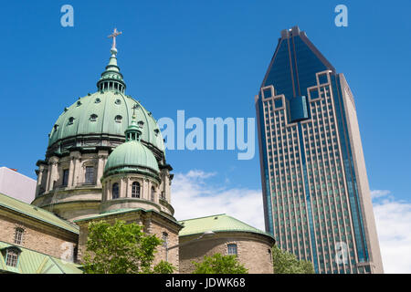 Mary Queen of the World Cathedral and Montreal's tallest Tower '1000 De la Gauchetiere' in Montreal Downtown, June 2017, Canada Stock Photo