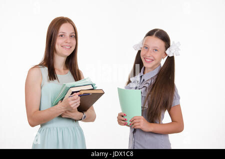 Portrait of a school teacher and a diligent student Stock Photo