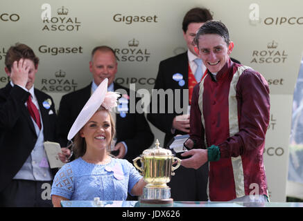 Ellie Simmonds presents a trophy to winning jockey Adam Kirby after the Queen Mary Stakes during day two of Royal Ascot at Ascot Racecourse. Stock Photo