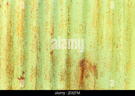 Corroded green metal background. Rusted green painted metal wall Stock Photo