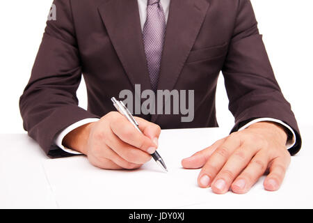 Business worker signing the contract to conclude a deal Stock Photo