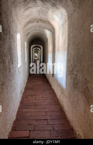 Long narrow corridor in an old antique building. Stock Photo