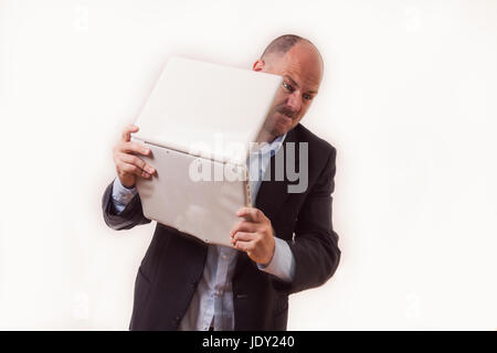 Bydgoszcz, Poland. 23rd June, 2017. A man in a suit full of anger tries to smash a laptop. Stock Photo
