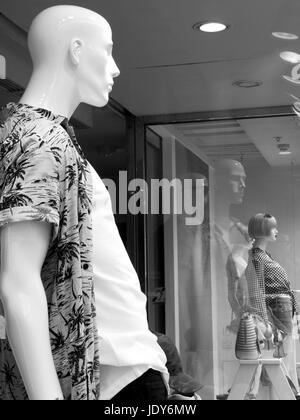 Monochrome manikin window display, River Island ladies and men clothing retailer, company founded in 1948 Stock Photo