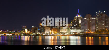 Pittsburgh, Pennsylvania skyline at night overlooking the Allegheny River with the Andy Warhol Bridge and Roberto Clemente Bridge in background. Stock Photo